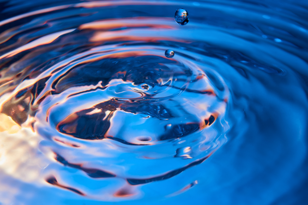 Drops,And,Watter,Ripples.,Color,Blue-red-yellow,Water,Background.